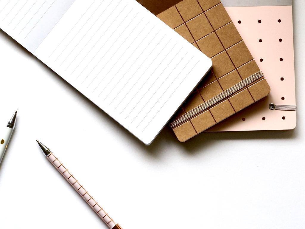 Modern organized workspace with digital tools and planning materials